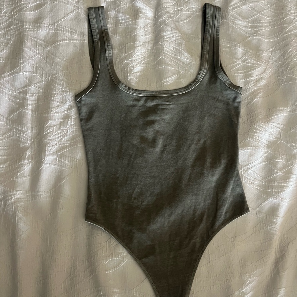 small grey form fitting bodysuit